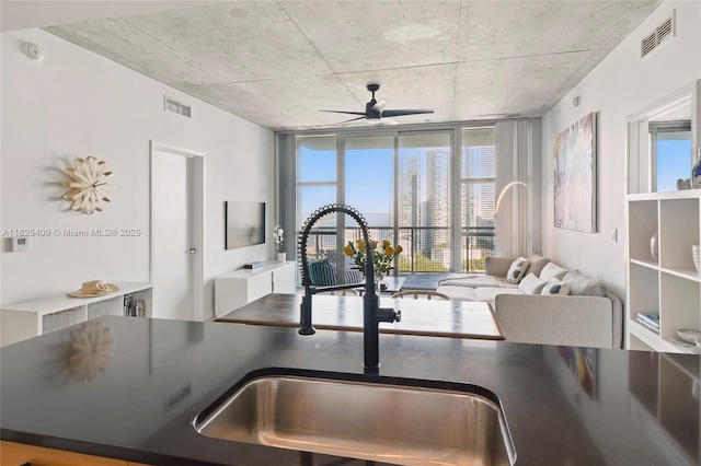 3301 NE 1st Ave Unit H2104, Miami, FL 33137 - kitchen featuring ceiling fan, dark countertops, and floor to ceiling windows