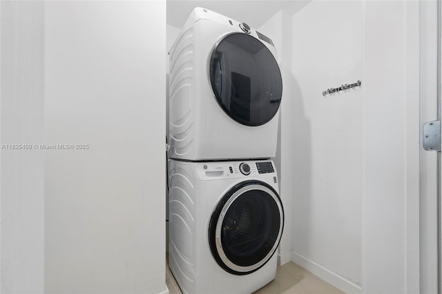 3301 NE 1st Ave Unit H2104, Miami, FL 33137 - laundry room featuring stacked washer and clothes dryer and light tile patterned flooring