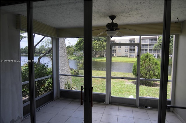 9420 Poinciana Pl Unit 115, Davie, FL 33324 - unfurnished sunroom featuring a water view and a ceiling fan