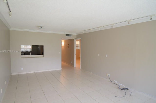 9420 Poinciana Pl Unit 115, Davie, FL 33324 - spare room with rail lighting, a textured ceiling, crown molding, and light tile patterned floors