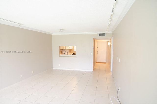 9420 Poinciana Pl Unit 115, Davie, FL 33324 - empty room featuring rail lighting, ornamental molding, and light tile patterned floors
