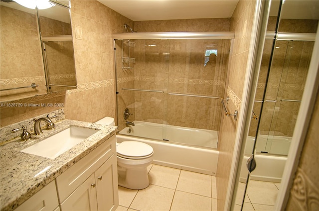 9420 Poinciana Pl Unit 115, Davie, FL 33324 - full bath with vanity, shower / bath combination with glass door, tile patterned flooring, and tile walls