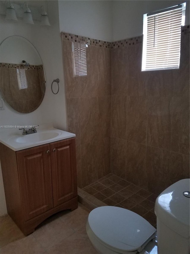 559 NW 44th St, Miami, FL 33127 - bathroom with vanity, tiled shower, and tile patterned floors