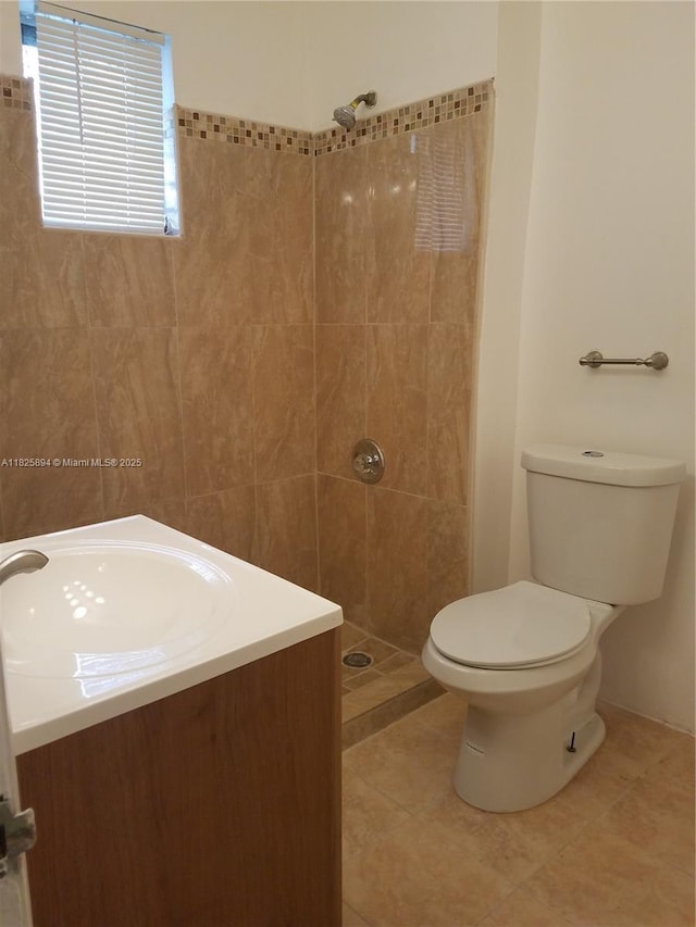 559 NW 44th St, Miami, FL 33127 - full bathroom with a tile shower, tile patterned floors, and vanity