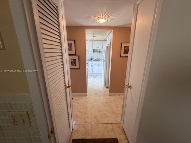 5200 Washington St Unit 207, Hollywood, FL 33021 - corridor with light tile patterned floors and baseboards