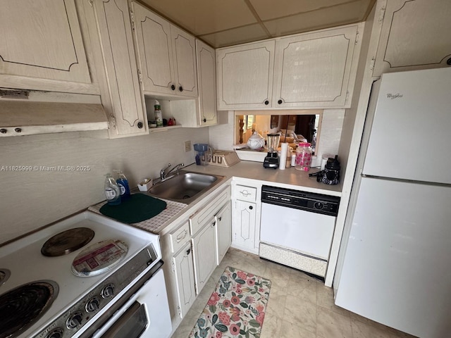5200 Washington St Unit 207, Hollywood, FL 33021 - kitchen featuring white appliances, under cabinet range hood, light countertops, white cabinets, and open shelves