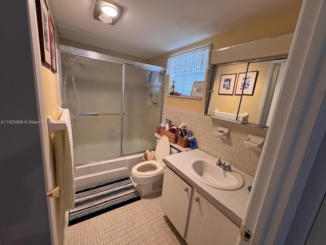 5200 Washington St Unit 207, Hollywood, FL 33021 - full bathroom with vanity, shower / bath combination with glass door, tile patterned floors, and tile walls
