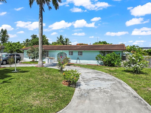 17430 SW 92nd Ct, Palmetto Bay, FL 33157 - single story home featuring curved driveway, stucco siding, and a front lawn