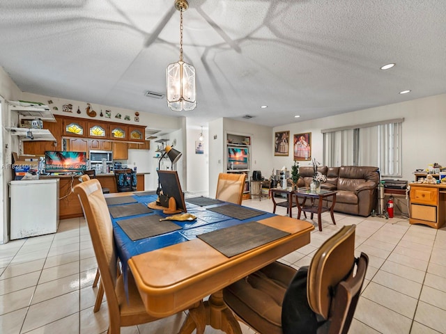 17430 SW 92nd Ct, Palmetto Bay, FL 33157 - dining room with light tile patterned floors, a chandelier, a textured ceiling, and recessed lighting