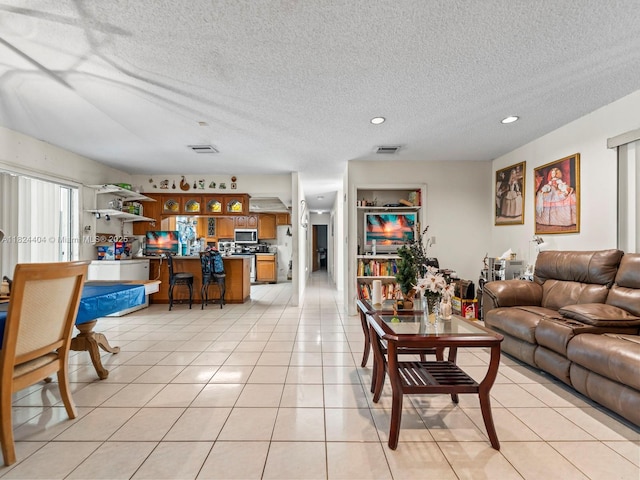 17430 SW 92nd Ct, Palmetto Bay, FL 33157 - living area featuring recessed lighting, light tile patterned floors, and a textured ceiling