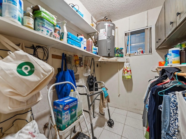 17430 SW 92nd Ct, Palmetto Bay, FL 33157 - laundry room with electric water heater, light tile patterned floors, and a textured ceiling