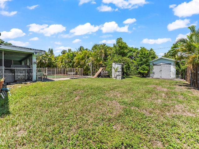 17430 SW 92nd Ct, Palmetto Bay, FL 33157 - fenced backyard featuring a storage unit