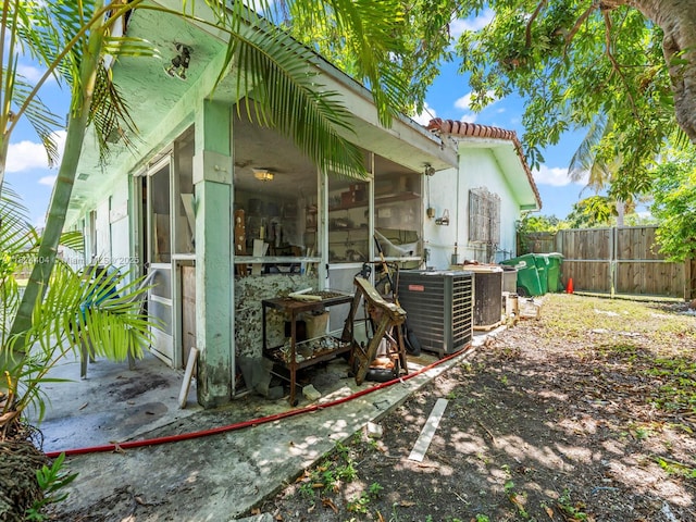 17430 SW 92nd Ct, Palmetto Bay, FL 33157 - view of side of home with a sunroom and a tiled roof