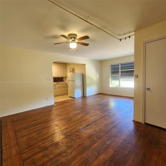 1843 Wiley St, Hollywood, FL 33020 - unfurnished room featuring ceiling fan, wood finished floors, and arched walkways