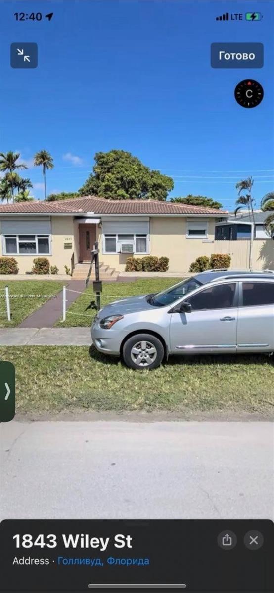 1843 Wiley St, Hollywood, FL 33020 - view of front facade featuring a tile roof and stucco siding