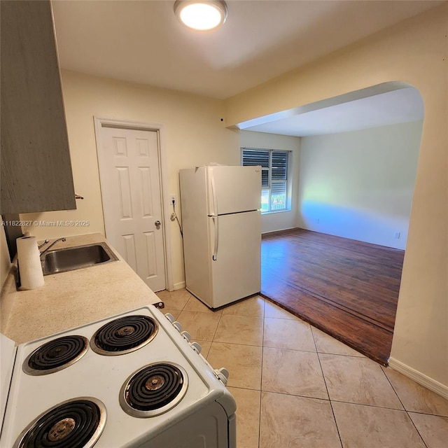 1843 Wiley St, Hollywood, FL 33020 - kitchen with white appliances, light countertops, and light tile patterned flooring