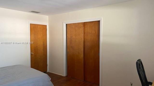 1843 Wiley St, Hollywood, FL 33020 - bedroom featuring a closet and wood finished floors