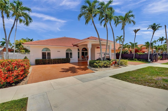 14241 SW 30th St, Miami, FL 33175 - mediterranean / spanish-style house featuring a tiled roof and stucco siding