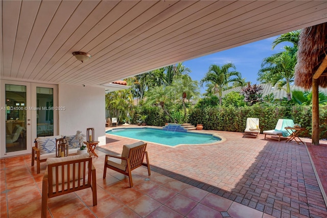14241 SW 30th St, Miami, FL 33175 - view of swimming pool featuring a patio and french doors