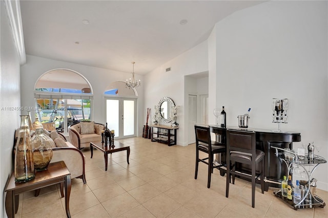 14241 SW 30th St, Miami, FL 33175 - living area featuring light tile patterned floors, a chandelier, and french doors