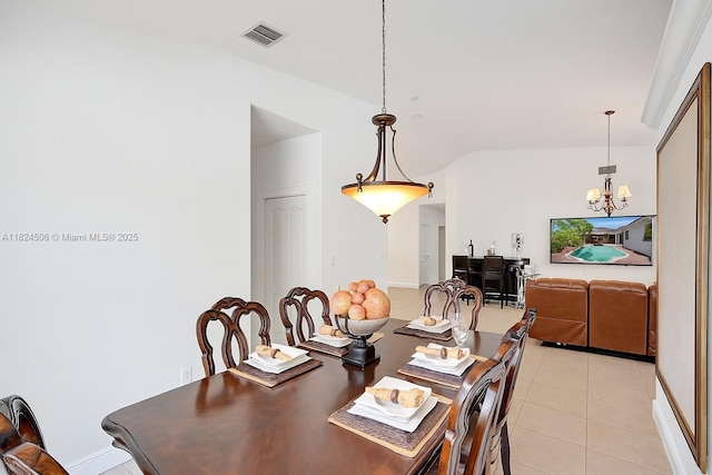 14241 SW 30th St, Miami, FL 33175 - dining room featuring a chandelier and light tile patterned floors