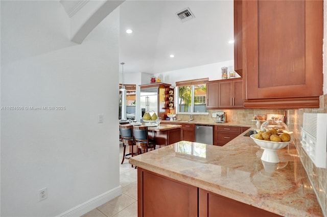 14241 SW 30th St, Miami, FL 33175 - kitchen featuring dishwasher, light stone countertops, backsplash, recessed lighting, and brown cabinets