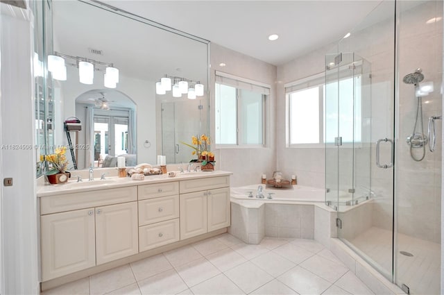14241 SW 30th St, Miami, FL 33175 - bathroom featuring tile patterned floors, a bath, a stall shower, and double vanity