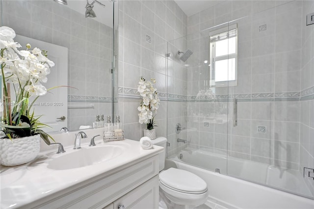 14241 SW 30th St, Miami, FL 33175 - bathroom featuring vanity, shower / bath combination with glass door, and tile walls
