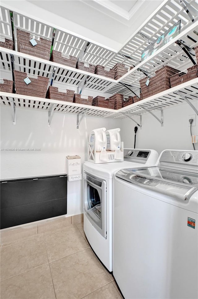 14241 SW 30th St, Miami, FL 33175 - washroom featuring independent washer and dryer and light tile patterned flooring