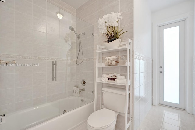 14241 SW 30th St, Miami, FL 33175 - full bathroom with bath / shower combo with glass door, plenty of natural light, tile walls, and tile patterned flooring