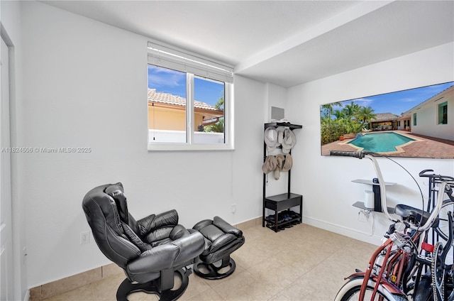 14241 SW 30th St, Miami, FL 33175 - workout area featuring baseboards and tile patterned floors