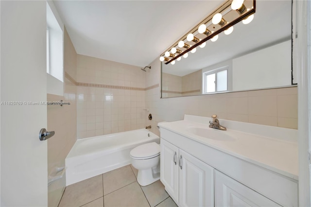 7830 Dickens Ave Unit 504, Miami Beach, FL 33141 - bathroom featuring vanity, tile patterned floors, shower / bathtub combination, and tile walls