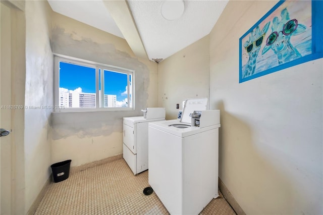 7830 Dickens Ave Unit 504, Miami Beach, FL 33141 - laundry room with washer and dryer and light colored carpet