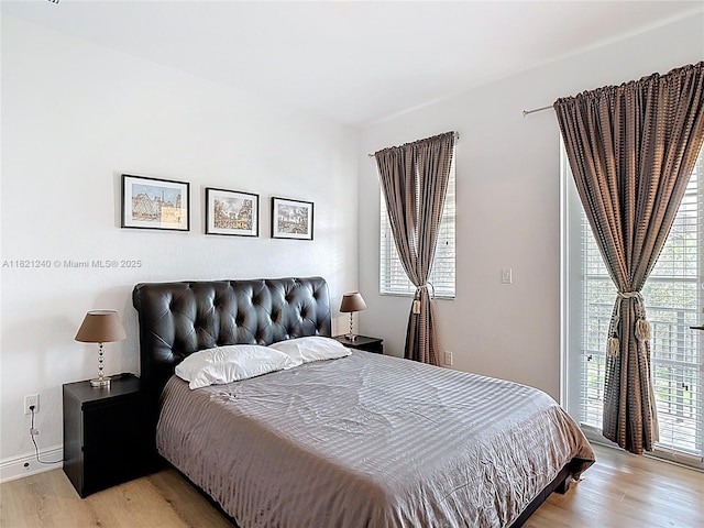 1214 SW 147th Ter, Pembroke Pines, FL 33027 - bedroom featuring light wood finished floors and baseboards