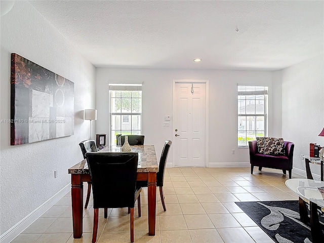 1214 SW 147th Ter, Pembroke Pines, FL 33027 - dining room featuring light tile patterned floors, a textured wall, and recessed lighting