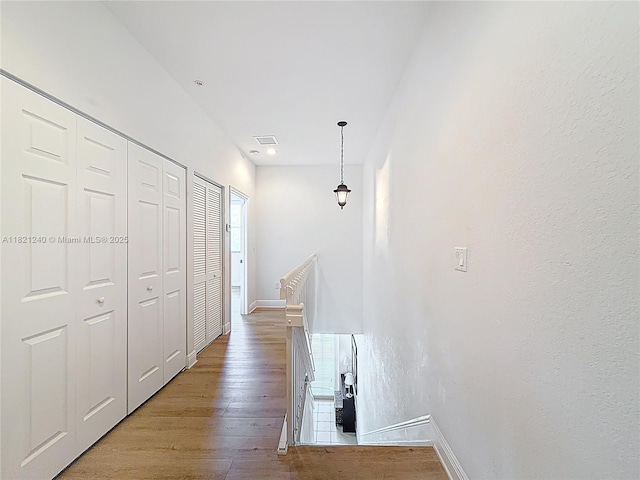 1214 SW 147th Ter, Pembroke Pines, FL 33027 - hall featuring light wood-style flooring and baseboards