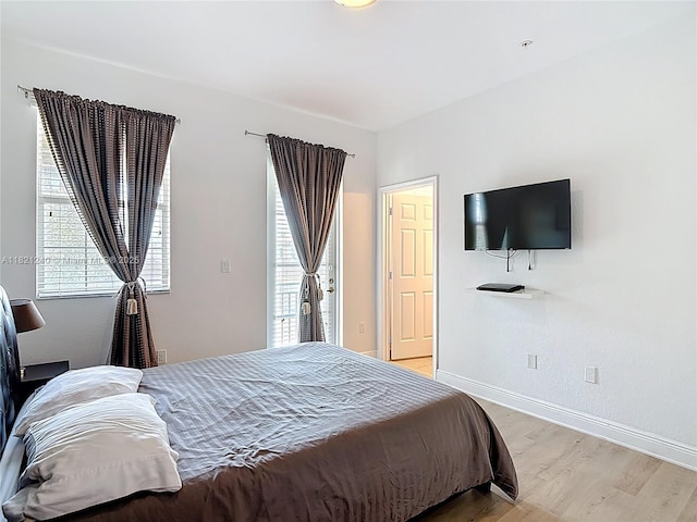 1214 SW 147th Ter, Pembroke Pines, FL 33027 - bedroom with light wood-type flooring and baseboards