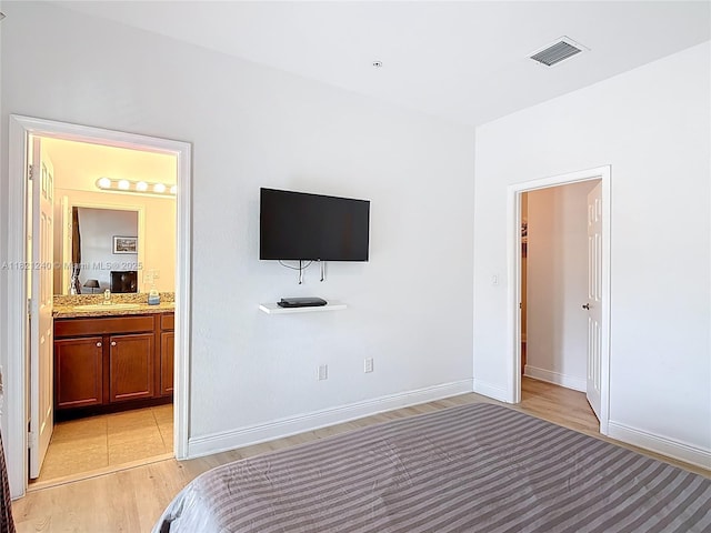 1214 SW 147th Ter, Pembroke Pines, FL 33027 - bedroom featuring ensuite bathroom and light wood-type flooring
