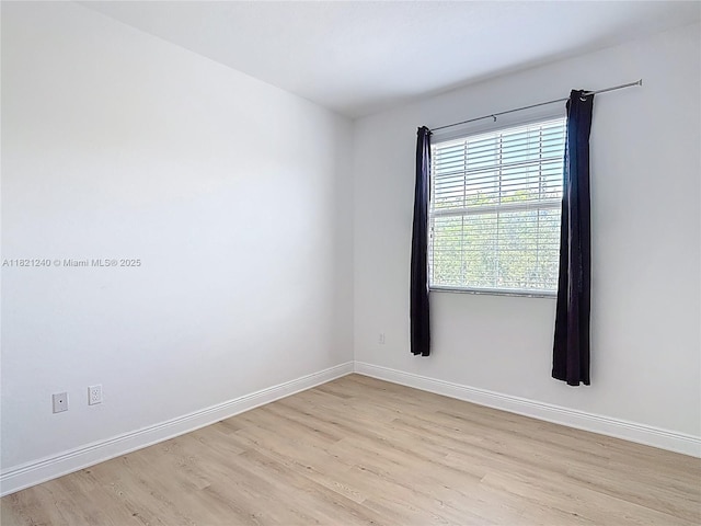 1214 SW 147th Ter, Pembroke Pines, FL 33027 - empty room with light wood-style flooring and baseboards
