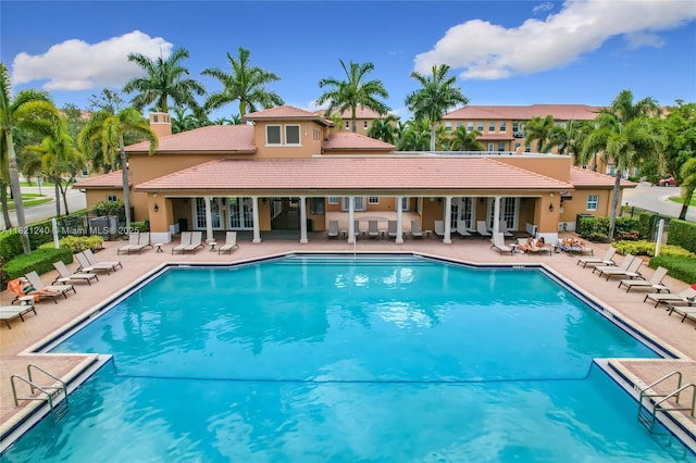 1214 SW 147th Ter, Pembroke Pines, FL 33027 - community pool featuring a patio area and french doors