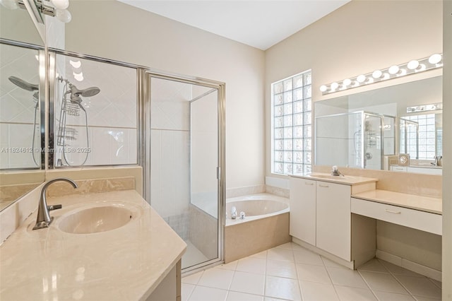 7348 Copperfield Cir, Lake Worth, FL 33467 - bathroom featuring a stall shower, a bath, two vanities, and tile patterned flooring