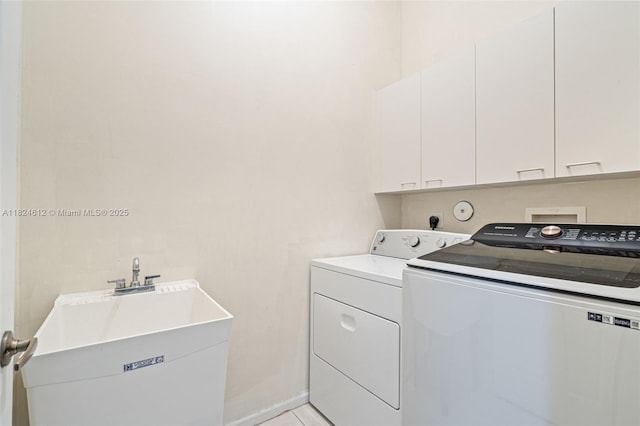 7348 Copperfield Cir, Lake Worth, FL 33467 - laundry room with washer and clothes dryer and cabinet space