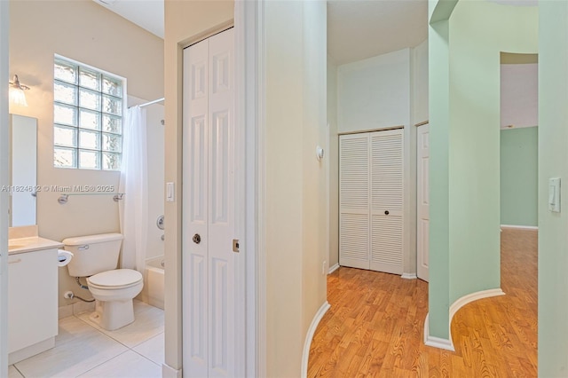 7348 Copperfield Cir, Lake Worth, FL 33467 - bathroom featuring a closet, vanity, shower / bath combo, and wood finished floors