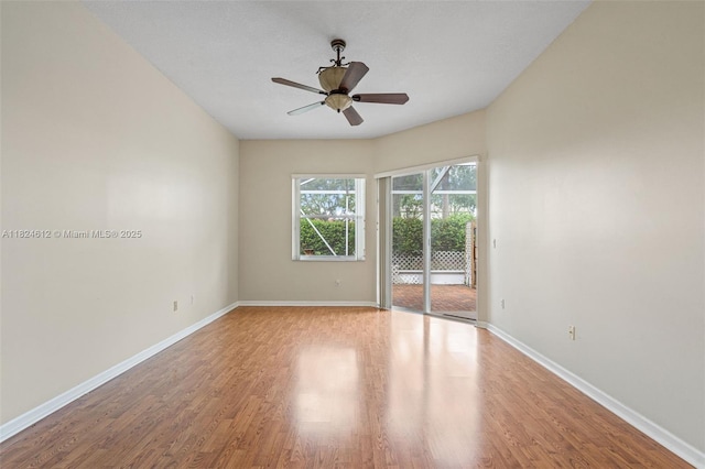 7348 Copperfield Cir, Lake Worth, FL 33467 - empty room featuring wood finished floors and a ceiling fan