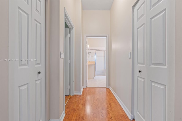 7348 Copperfield Cir, Lake Worth, FL 33467 - hall with baseboards and light wood-style floors