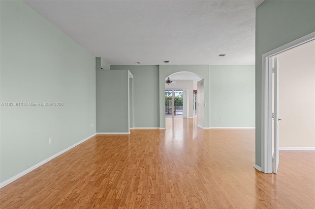 7348 Copperfield Cir, Lake Worth, FL 33467 - spare room with light wood-style flooring and arched walkways