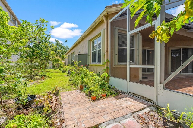 7348 Copperfield Cir, Lake Worth, FL 33467 - view of side of property featuring stucco siding and a patio