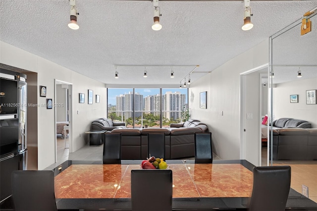3701 N Country Club Dr Unit 2209, Aventura, FL 33180 - dining room featuring rail lighting and a view of city