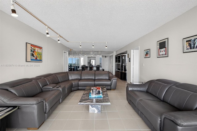 3701 N Country Club Dr Unit 2209, Aventura, FL 33180 - living area with light tile patterned flooring, track lighting, and a textured ceiling