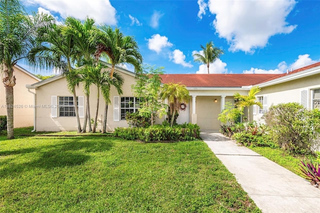806 NE 214th Ln Unit 806-03, Miami, FL 33179 - view of front of house featuring stucco siding, a front lawn, and driveway